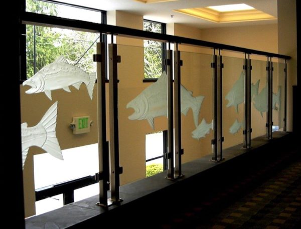 Custom etched glass panel used with stainless steel railing