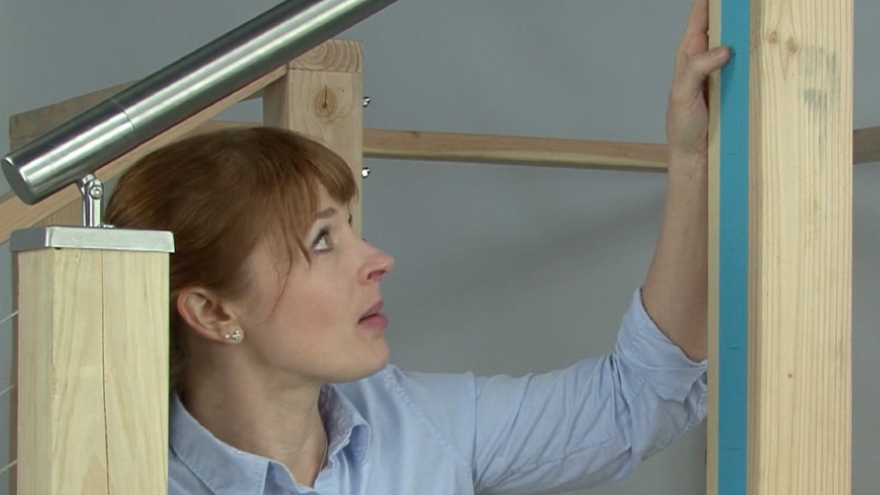 Mark cable sleeve hole locations on wood railing posts