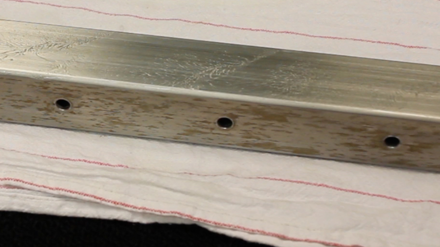 Wait while passivation solution works on stainless steel railing