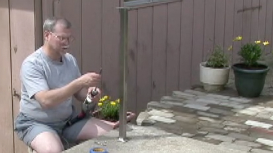 Attach a masonry drill bit for concrete railing post installation