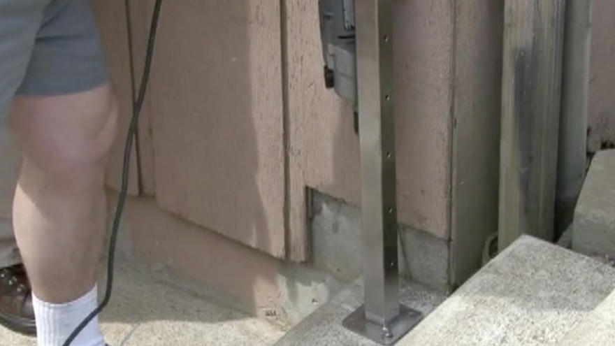 Drill the second diagonal concrete anchor hole through the base plate