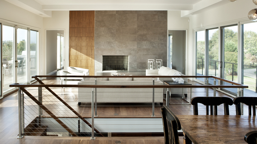 contemporary cable railing on stairs and deck. Interior and exterior railing installed in the same home.