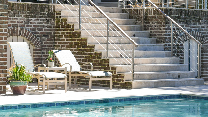 Cable Rail mounted on concrete steps. Step railing installation hardware.