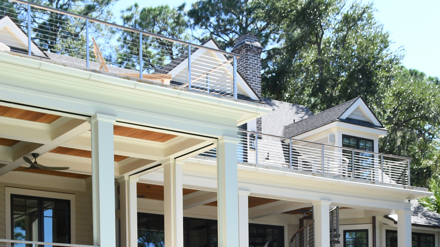 Custom-built luxury home with Rainier cable railing on the front porch, back porch, balcony, deck, and stairs.