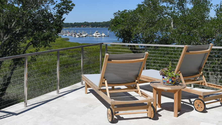 Patio handrail and cable railing with wood top rail.