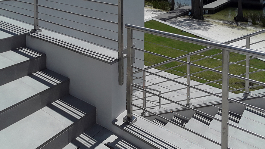 A railing install with surface mount posts, side mount posts and angled top mount posts was custom-built for this unique luxury property. Top mount vs. side mount posts - a well designed railing should allow you to switch between the options as needed.