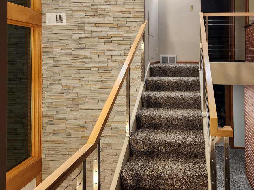 Modern staircase with custom cable railing