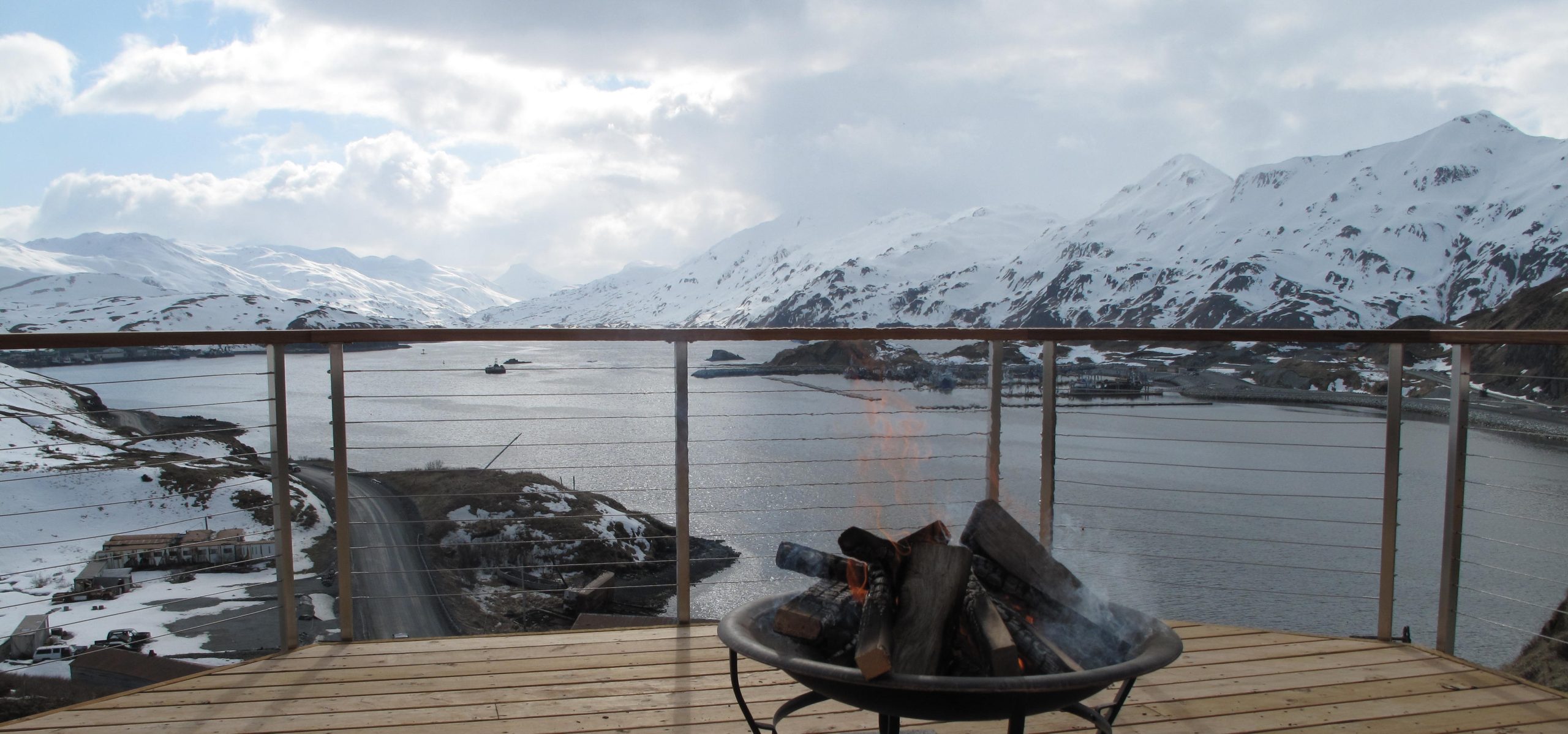 deck with view of water and mountains